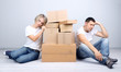 Photo: Young couple moving in new house Young couple moving in new house