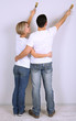 Young couple doing renovation together.