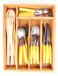 Wooden cutlery box with checked cutlery isolated on white