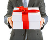 Young businessman present gift box, isolated on white