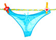 Women's panties hanging on rope isolated on white