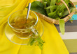 Glass cup of tea with linden on napkin close-up