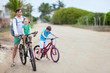 Father and kids on bikes