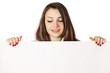 women holding a sheet of paper
