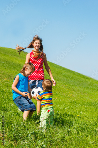 Photo: Laughing kids playing with a ball Laughing kids playing with a ball