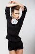 Elegance. Luxury. Ultramodern Lady in Black Shorts. Fashion