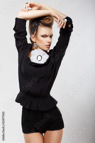 Photo: Elegance. Luxury. Ultramodern Lady in Black Shorts. Fashion Elegance. Luxury. Ultramodern Lady in Black Shorts. Fashion