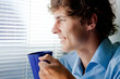 man with a cup of tea in office