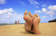Sandy feet on a tropical beach