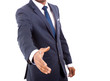 Photo: African American business man offering handshake over white back African American business man offering handshake over white back