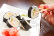 Photo: sushi with chopsticks sushi with chopsticks