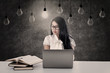 Beautiful woman study under light bulbs