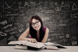 Photo: Happy student and written blackboard Happy student and written blackboard