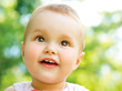 Little Baby Girl Portrait outdoor. Child over nature background