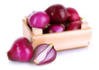 Purple onion in wooden box isolated on white