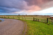 sunrise over road and meadow