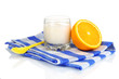Delicious yogurt in glass with orange isolated on white