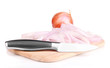 Onion cut with rings on wooden board isolated on white