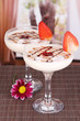Fruit smoothies on table on window background