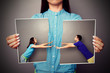 woman holding the lacerated photo of couple