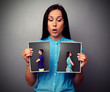 woman looking at disrupt photo of couple