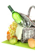 Picnic basket with fruits and bottle of wine, isolated on white