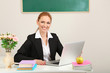 Photo: Portrait of teacher woman working in classroom Portrait of teacher woman working in classroom