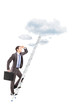 Full length portrait of a businessman with briefcase climbing a