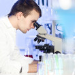Photo: Health care professional in lab. Health care professional in lab.