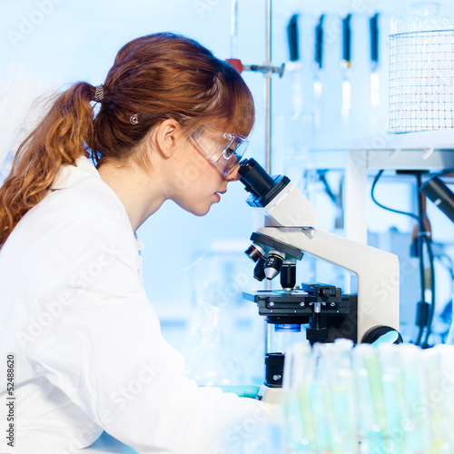 Photo: Health care professional in lab. Health care professional in lab.