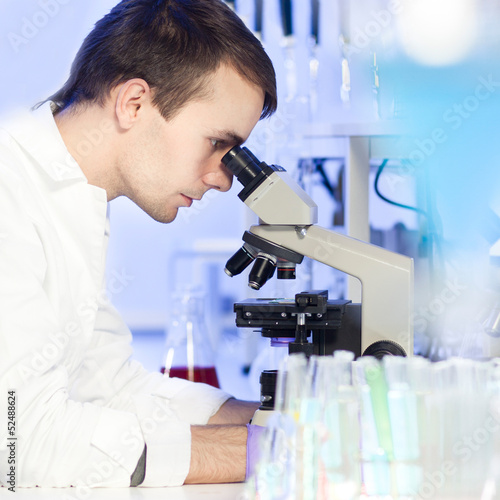 Photo: Health care professional in lab. Health care professional in lab.