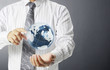 Photo: earth globe in his hands earth globe in his hands