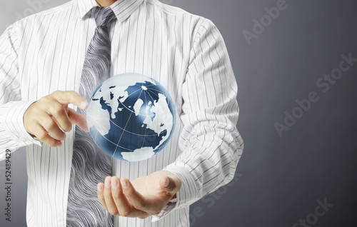 Photo: earth globe in his hands earth globe in his hands