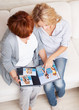 Foto: Mother and daughter looking photo book Mother and daughter looking photo book