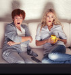 Foto: Mother with adult daughter watching television Mother with adult daughter watching television