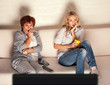 Foto: Mother with adult daughter watching television Mother with adult daughter watching television