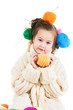 Girl with knitting spokes and balls of threads in hair