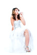 Young and beautiful  woman drinking coffee from a white cup