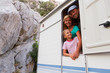 Foto: Holiday travel - family in caravan on camping Holiday travel - family in caravan on camping