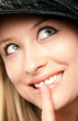 Smiling woman showing shush