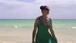 Video: Woman in dress walking on the beach, super slow motion Woman in dress walking on the beach, super slow motion