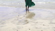Woman legs walking on the beach, super slow motion
