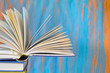 pile of books, one open, free copy space