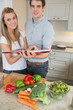 Happy couple with cookery book