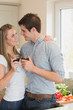 Couple drinking wine and looking into each others eyes
