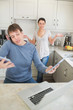 Man busy with technology while his wife wondering why