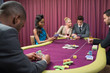 Man looking at his poker cards