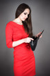 beautiful woman looking at an empty purse