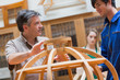 Explaining teacher in a woodwork class