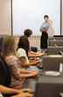 Teacher standing in front of projection screen